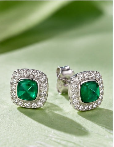 Marhabu emerald halo stud earrings in soft green lifestyle setting