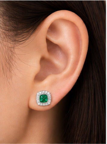 Marhabu emerald halo stud earring worn on ear for scale