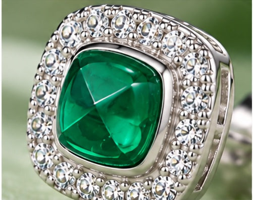 Close-up of Marhabu lab-created emerald halo stud earring stone and micro-pave setting
