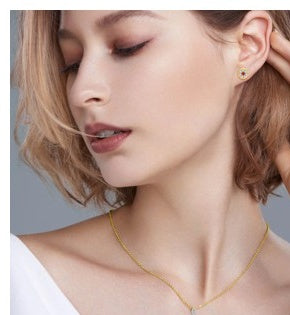 Model wearing Scarlet Halo moissanite pendant necklace in gold-tone 925 sterling silver